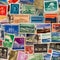 A collage of vintage postage stamps from around the world, showcasing diverse cultures and histories5, Generative AI