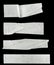 Collage white pieces of scotch tape isolated on a black background.  set stripes of masking tape. Insulating tape