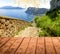 The collage from wooden floor and view of Capri island, Italy
