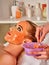 Collagen face mask . Facial skin treatment. Woman receiving cosmetic procedure.