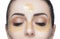 Collagen gold patches on the skin of the eyelid, forehead and chin on the face