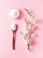 Collagen powder in wood spoon, supplement, healthy and anti age concept flat lay on pink background