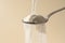 Collagen protein powder pouring in a spoon. Food beauty and health supplement