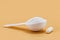 Collagen spoon and pills, protein responsible for ensuring firmness and elasticity to the skin. Hydrolyzed Collagen Powder