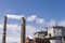 collapsed concrete chimney on the heat of a power plant and oil refinery after an air attack by missiles and drones