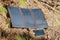 Collapsible solar panel charges a smartphone