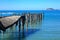 Collapsing wooden wharf in the ocean. Tokomaru Bay, New Zealand