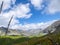 Colle Del Puriac - Flower field on alpine meadow with scenic view of mountains and hills in valley Valle Stura, Italy