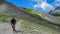 Colle Del Puriac - Man on mtb cycling uphill along alpine road with scenic view of mountains and hills in valley Valle Stura