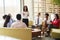 Colleagues listening to presentation by a female manager