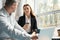 Colleagues, a man and a woman, communicate during coffee break