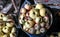 Collected ripe apples lie in a basket and in a bucket