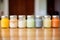 a collection of baby food jars on kitchen cabinet