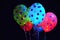 A collection of balloons emitting a radiant glow, creating a captivating sight against the dark backdrop of the night, Glow-in-the
