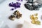 Collection of beautiful precious stones on white table.