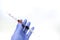 Collection of blood samples in syringes To detect  Coronavirus,Covid-19 In the hand, With wearing blue protective gloves separated