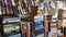 Collection of books and novels. A book store at an exhibition fair. Pile of literature kept in a library.