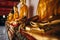 Collection of Buddha figures gilded with gold leaves by King Rama I at Phra Rabiang  cloister in Wat Pho Wat Po temple in