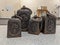 A collection of cast iron vintage lb weights on a lab table