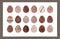 Collection of chocolate doodle eggs on white background.