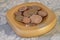 Collection coins copper pence savings in wooden bowl