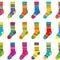 Collection of colored socks with stripes. Seamless pattern of socks