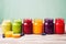 collection of colorful fruit puree jars