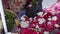 a collection of colorful red white green flowers at a flower seller