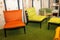 Collection of colorful seats on decorative green floor