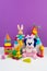 Collection of colorful toys on purple background. Kids toys
