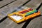 Collection of coloured screwdrivers on a wooden bench