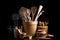 collection of cooking utensils, including wooden spoons and spatulas, on black background