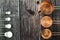 Collection of copper measuring cups and metal measuring spoons on old wood table