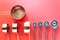 Collection of copper measuring cups and metal measuring spoons on red background