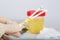 Collection cup with urine test on a table of a lab technician.