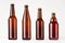 Collection different brown beer bottles, mockup.