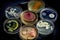 collection of different strains of bacteria, each in its own petri dish