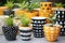 a collection of diy painted ceramic pots