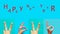 Collection of female hands gesturing the digits of the new year 2020 in sign language on blue background and the text - Happy New