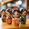 Collection of four Asian dolls with cute cartoonish designs