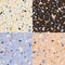 Collection of four terrazzo seamless pattern designs with hand drawn rocks. Abstract modern background, flat vector