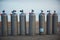 Collection of grey scuba diving air oxygen tanks.