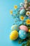 A collection of hand-painted Easter eggs with a lively floral backdrop on a blue surface.