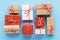 Collection of handcrafted gift boxes on light blue background