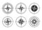 Collection of logos of the compass. Stylized sea compasses with a wind rose. Measuring device. Black and white vector