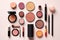 collection of make up and cosmetic beauty products arranged on pink background. each one is shot separately, top view of makeup