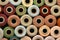 Collection of Natural Colored Vintage Yarn Spools Background