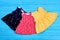 Collection of newborn colorful dresses.