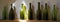 Collection of old dirty green bottles used for apple cider drink