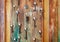 Collection of old keys on shabby wooden doors
